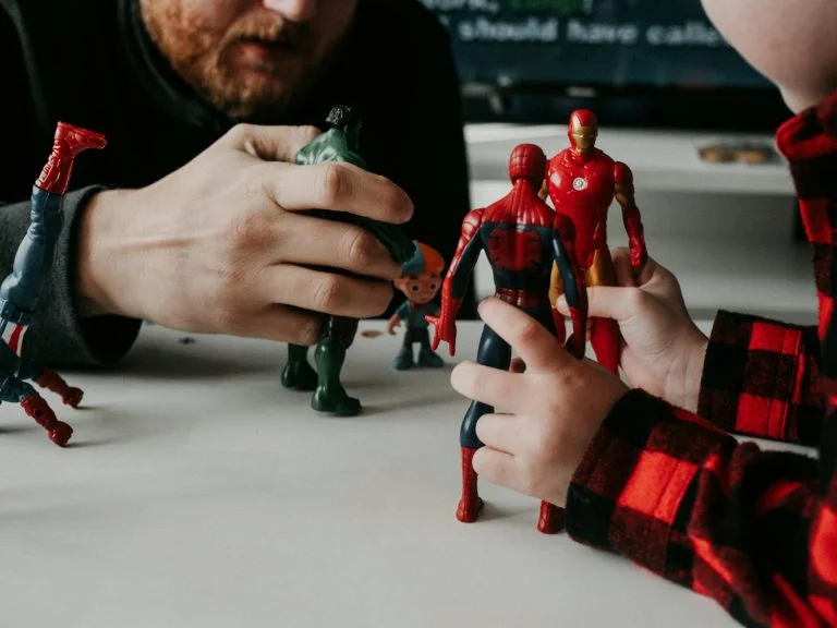 Father and child playing together with superhero action figures, Covenant Eyes Alternatives: The Best Accountability Apps for 2025